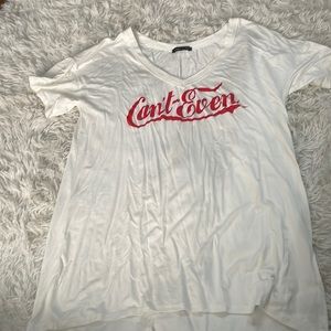 This is a super cute shirt it says can’t even and is oversized.